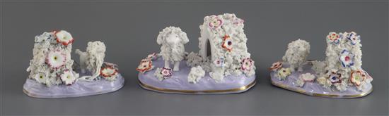 Three Staffordshire porcelain figures of a poodle and kennel, c.1835-45, L. 10.5cm and 9cm